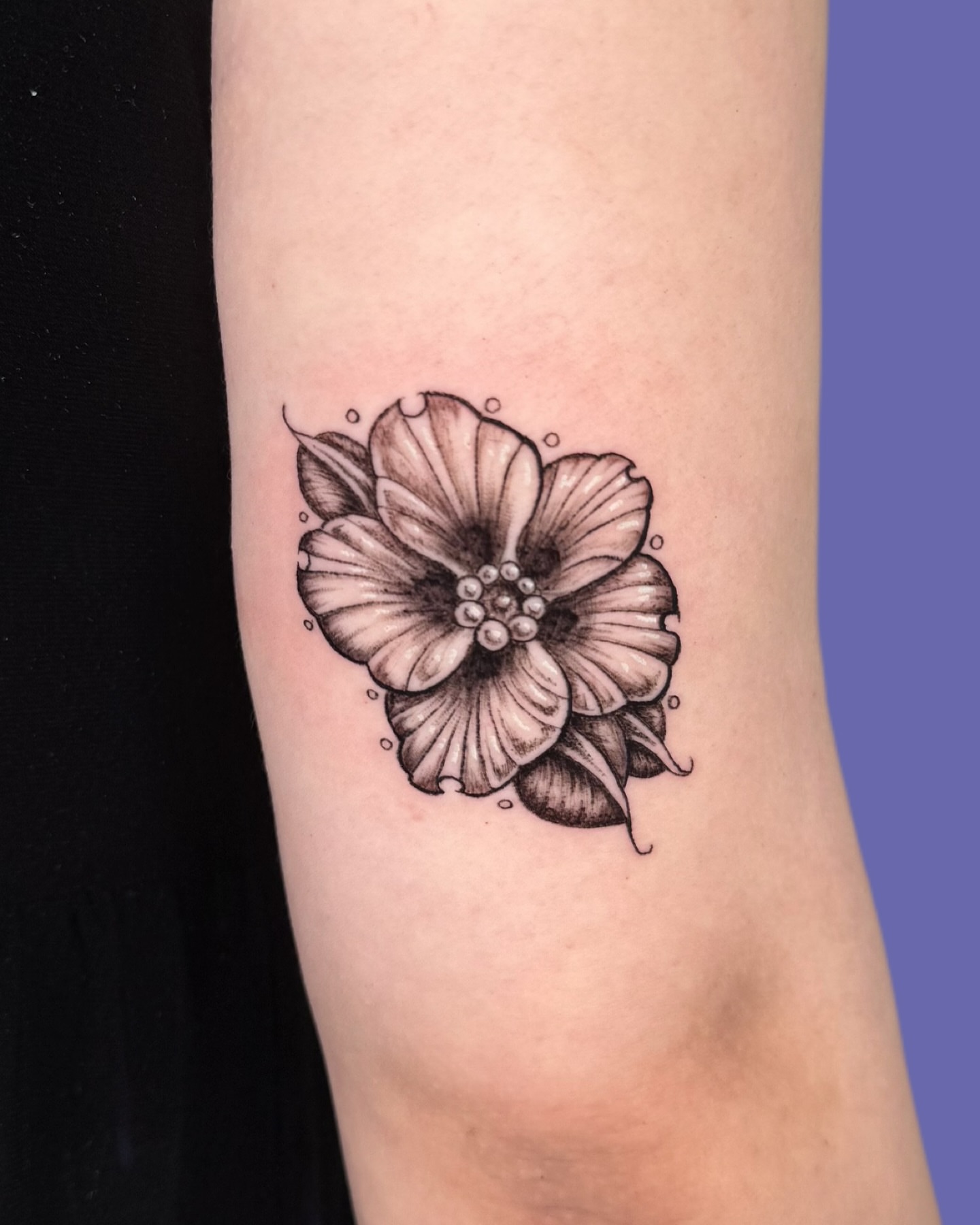 Flower black and grey tattoo on the forearm by Diana