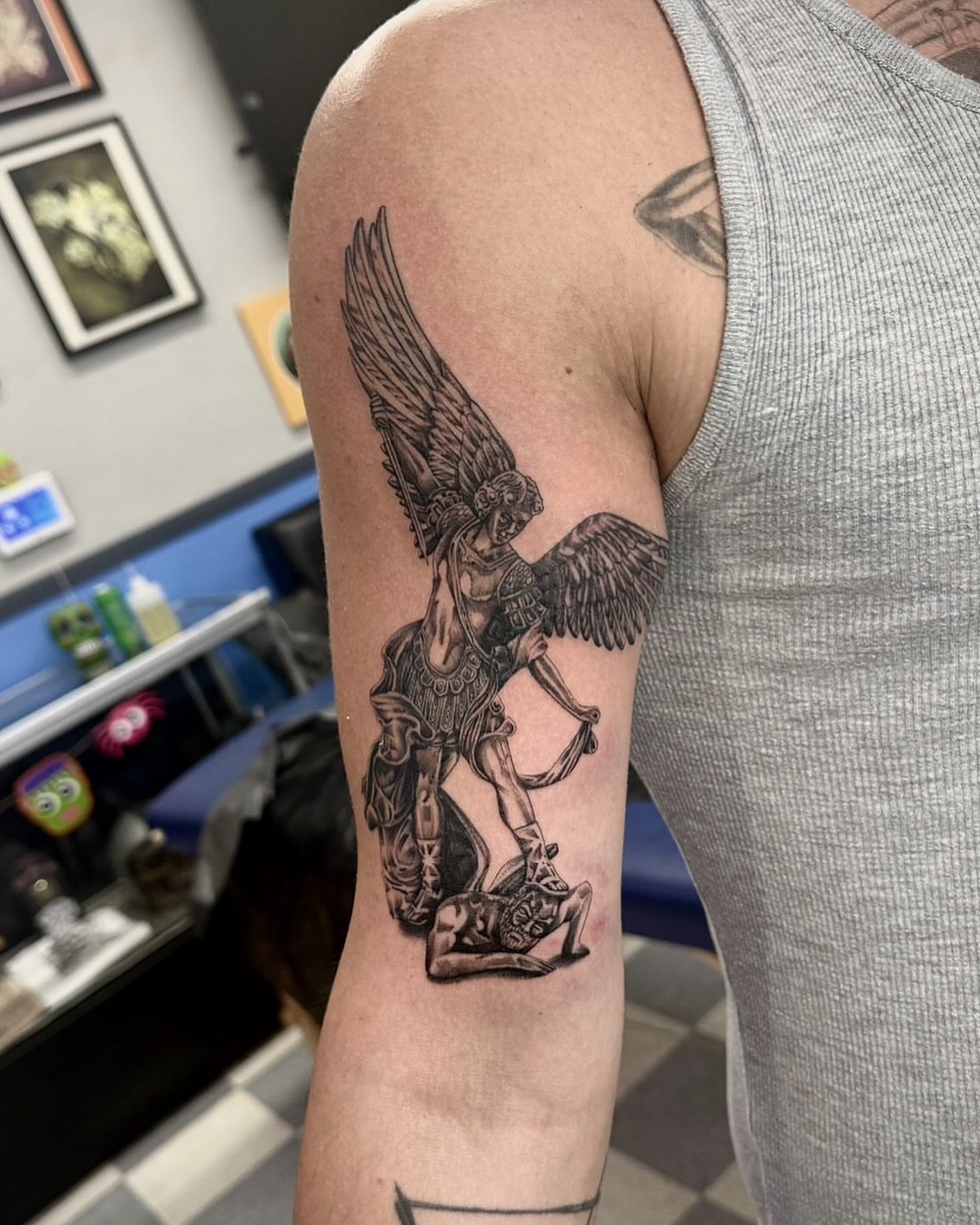 Angel with sword black and grey tattoo on the forearm by Manny