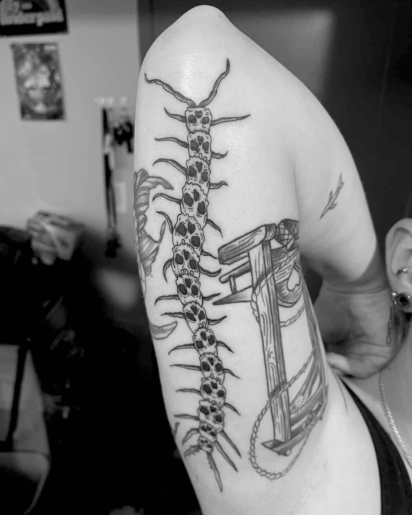 Centipede black and grey tattoo on the forearm by Bryan Black