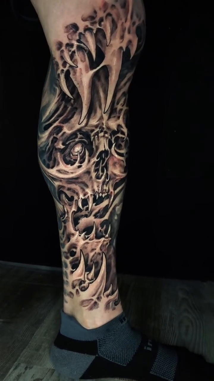 Skulls and organic forms dark realism tattoo by Oak Adams