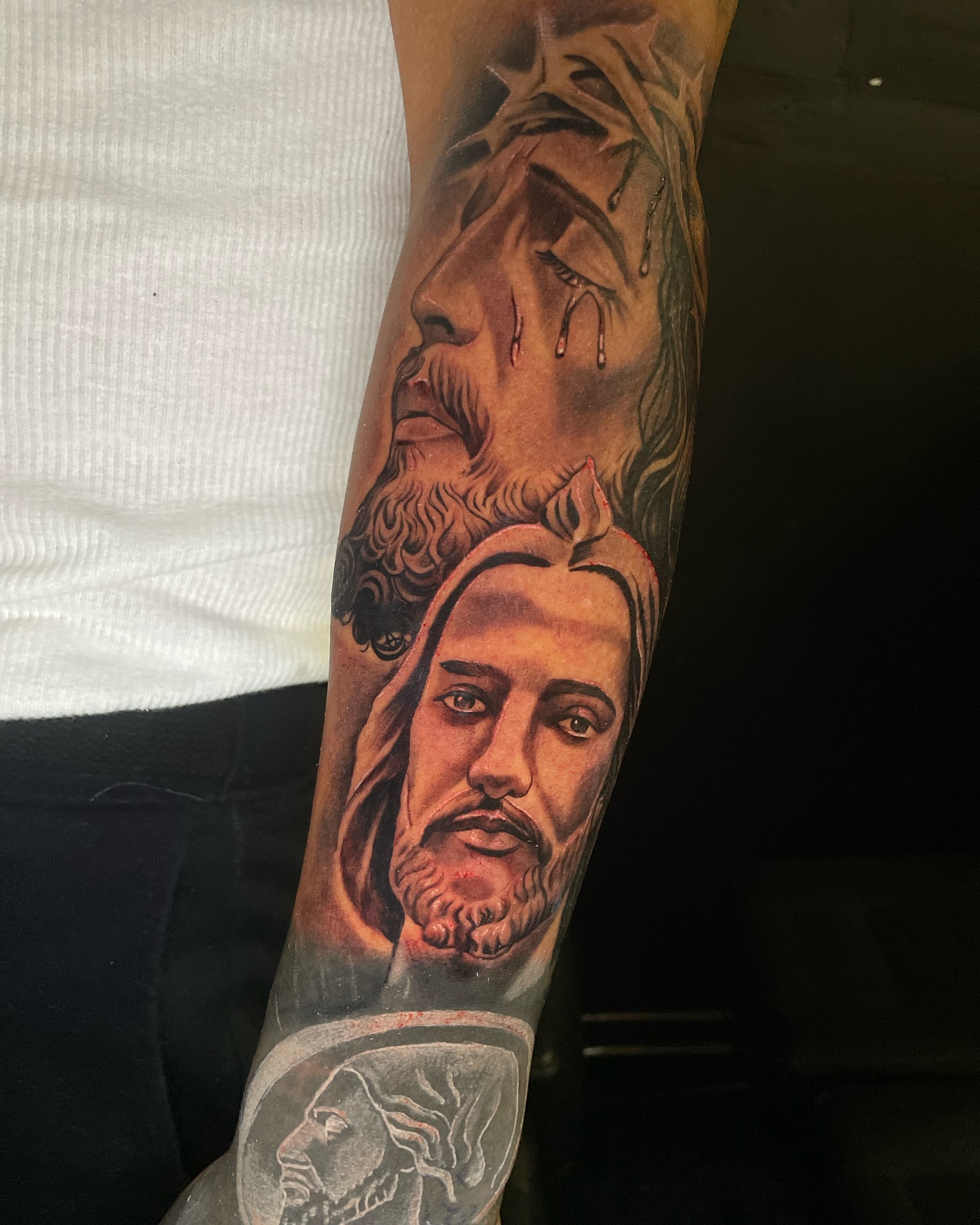 Religious figures realism tattoo on the forearm by Vic