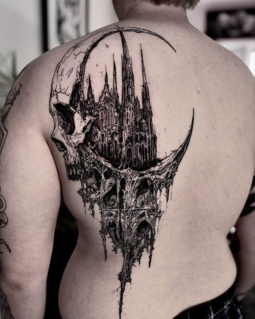 Skull with gothic castle and moon dark art tattoo on the back by Bwk Dark Art