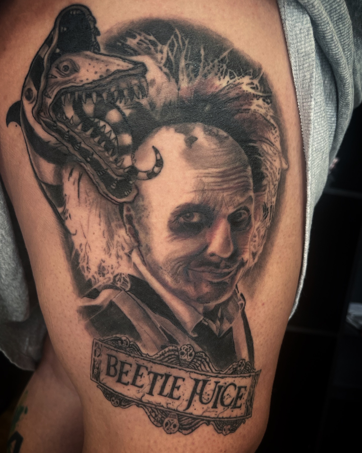 Beetlejuice realism tattoo on the forearm by @tattoos_by_elijah