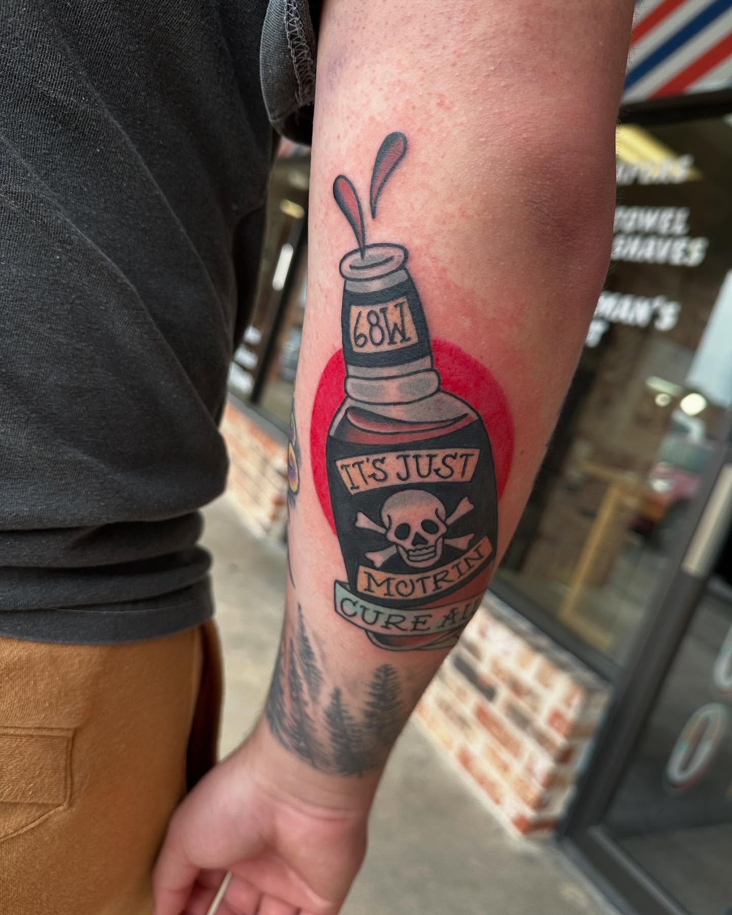 Motrin bottle American traditional tattoo on the forearm by Whitney Creep Tattoos