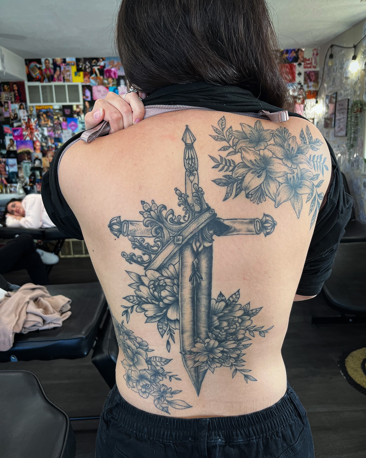 Cross and floral black and grey tattoo on the back by @inkspirationtattoo_co
