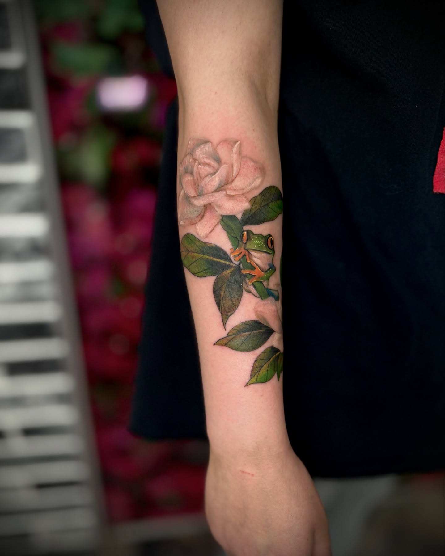 Rose and frog realism tattoo on the forearm by Mitsuko Ching