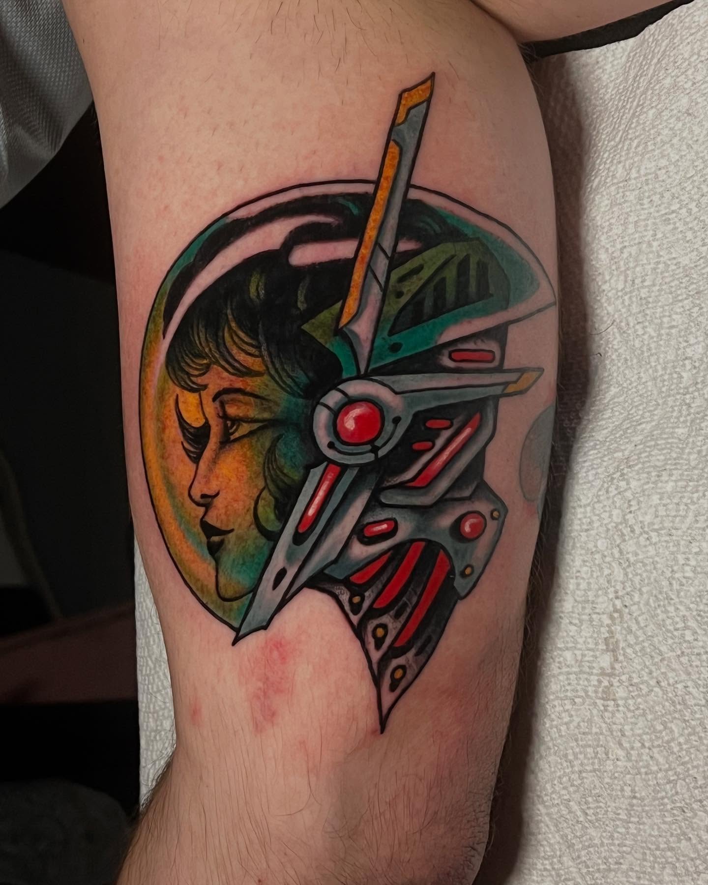 Cyborg head geometric tattoo on the forearm by Matt E.