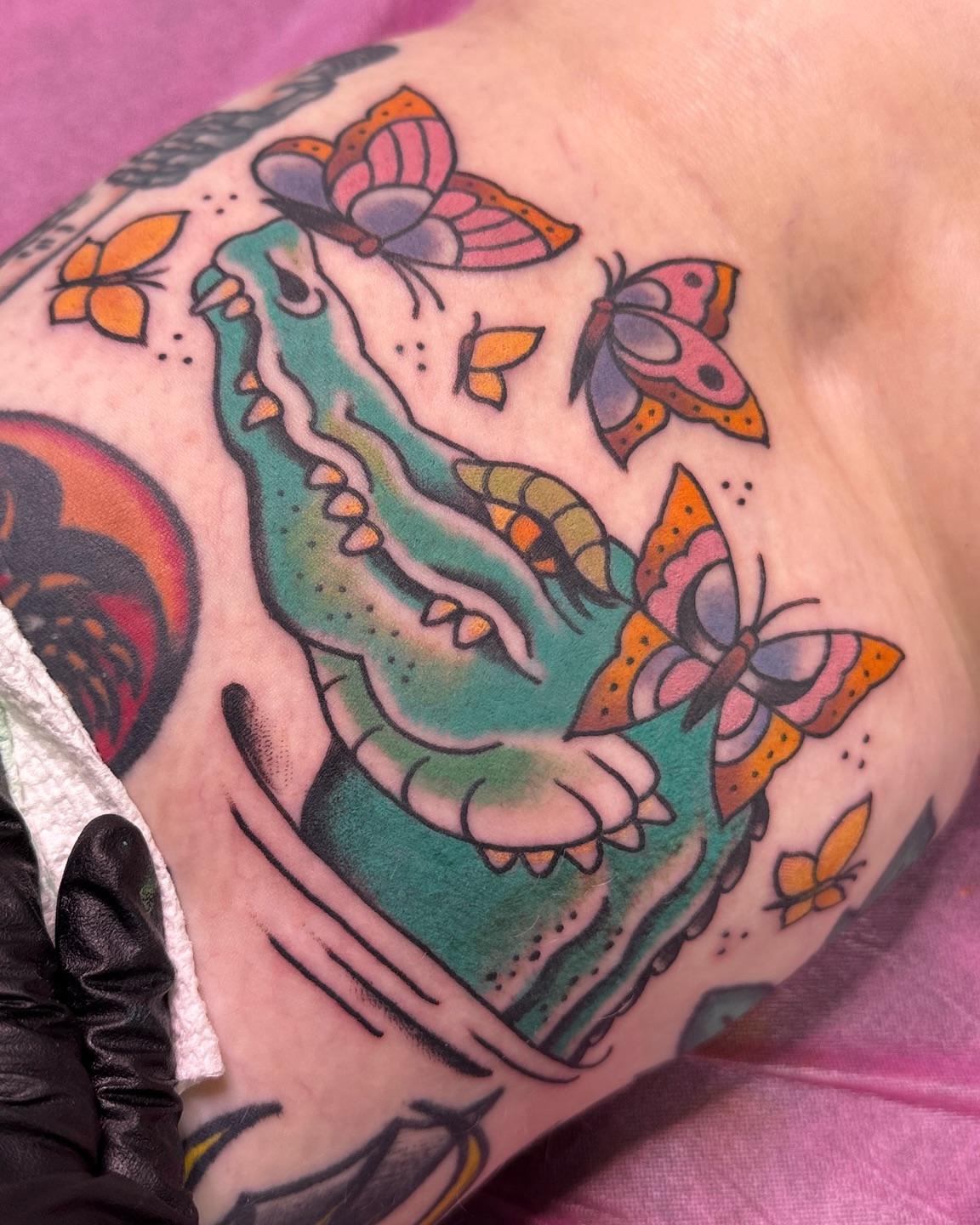 Alligator and butterflies American traditional tattoo on the upper arm by Tannis - Traditional Tattoos in Richmond, VA, Richmond, Virginia