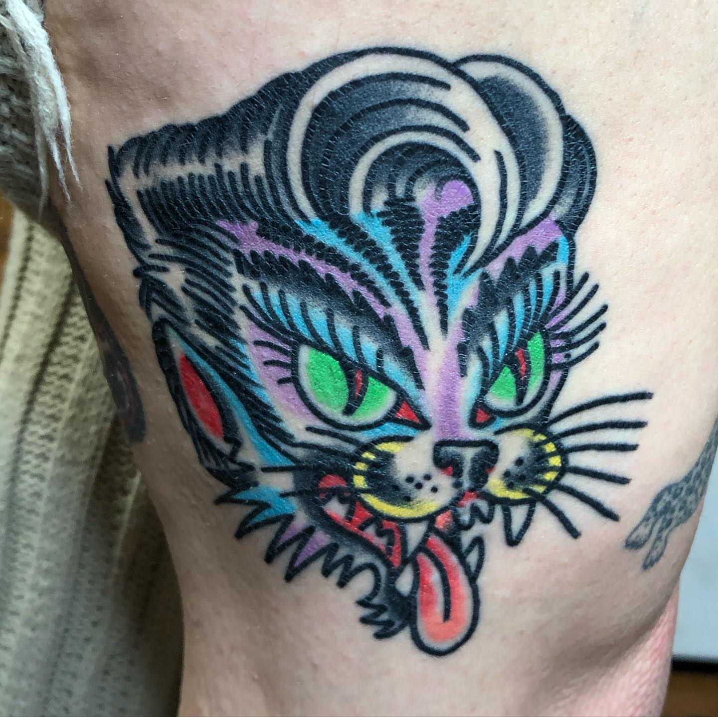 Cat American traditional tattoo on the forearm by Tattoo