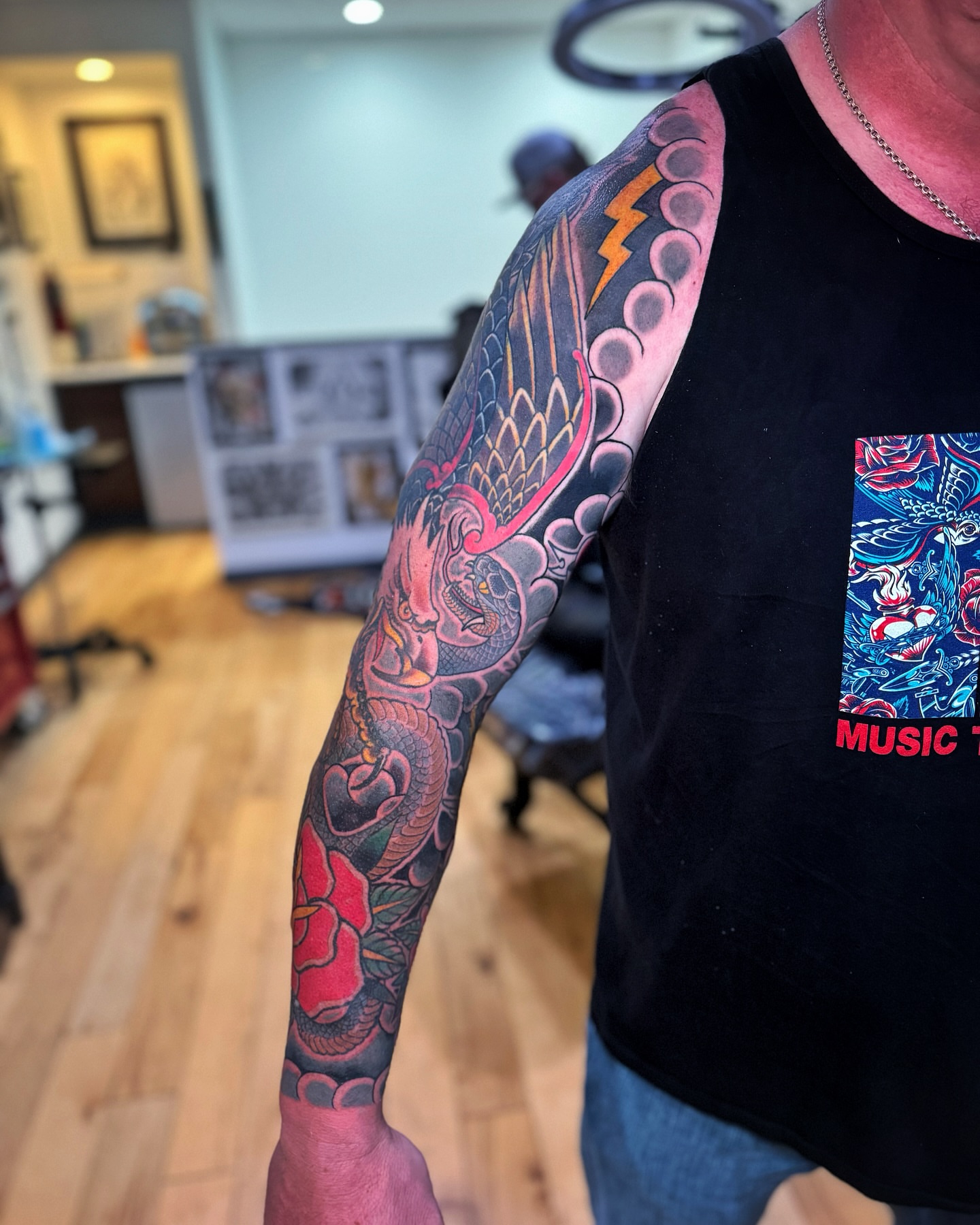 Dragon and flowers japanese irezumi tattoo on the upper arm by David Gray