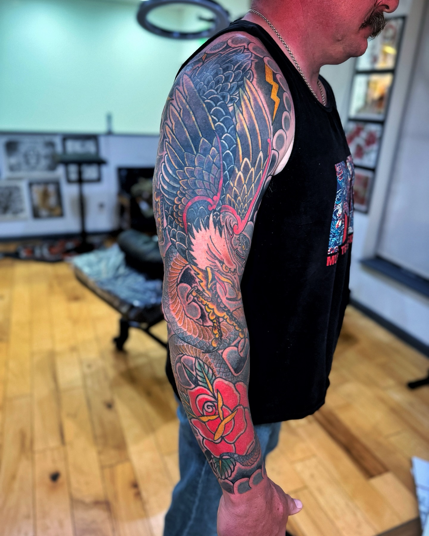 Dragon and rose japanese irezumi tattoo on the upper arm by David Gray