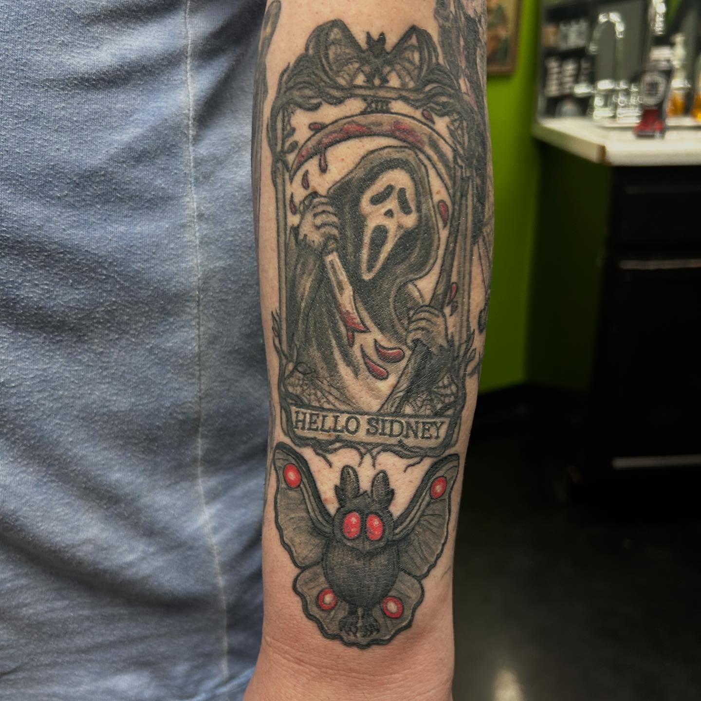 Scream mask American traditional tattoo on the forearm by B Hendrix, Cuyahoga Falls, Ohio