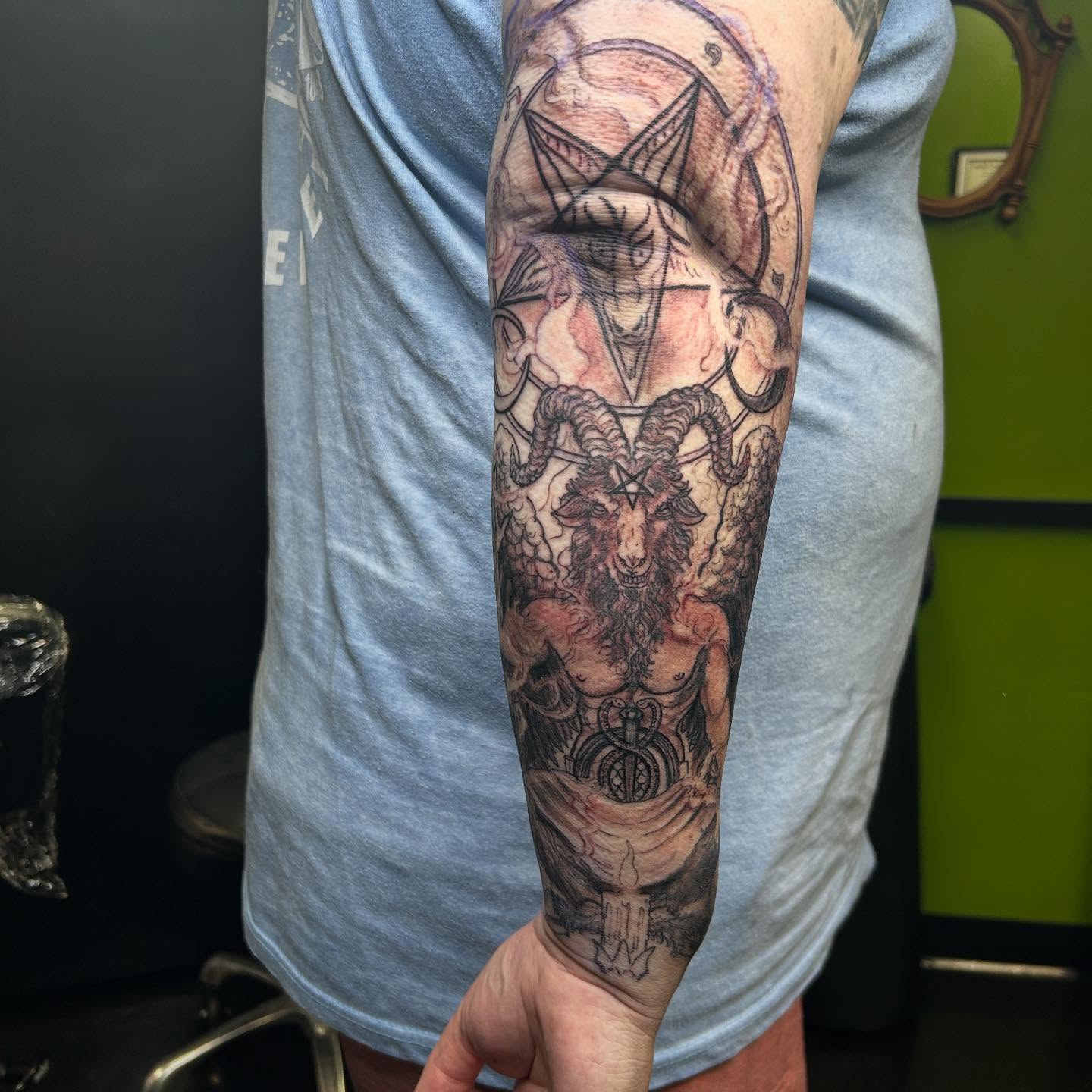 Goat-headed demon dark realism tattoo on the forearm by B Hendrix, Cuyahoga Falls, Ohio