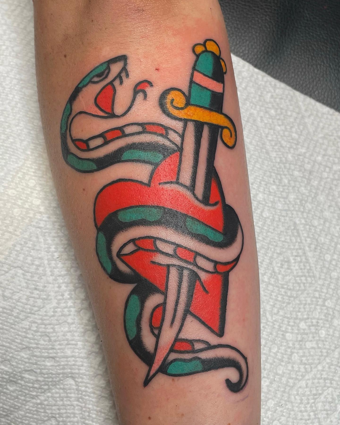 Snake and dagger American traditional tattoo on the forearm by nancy❣️
