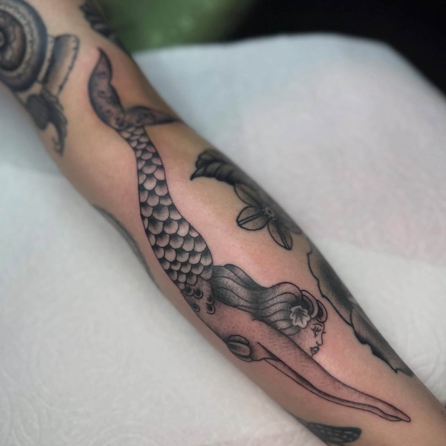Mermaid American traditional tattoo on the forearm by chloe jeanel estrada