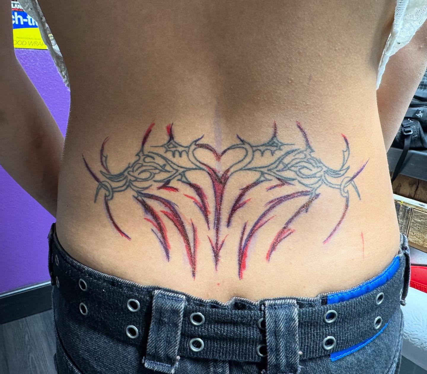Flames and thorns tribal tattoo on the torso by Justina🪐