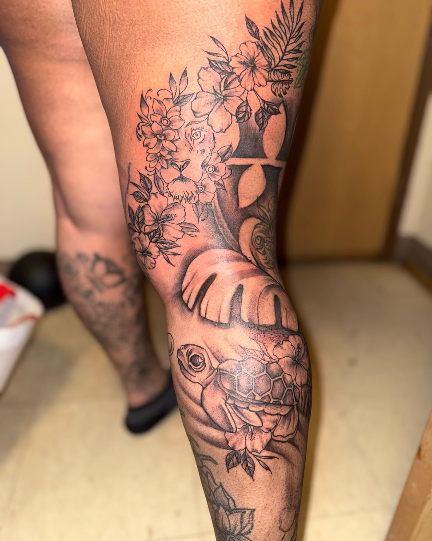 Lioness and turtle realism tattoo on the thigh by Aja Marie