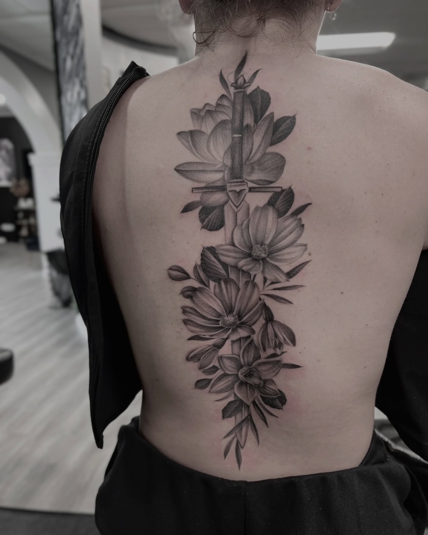 Lotus flowers and bamboo realism tattoo on the back by Chelsea Speirs