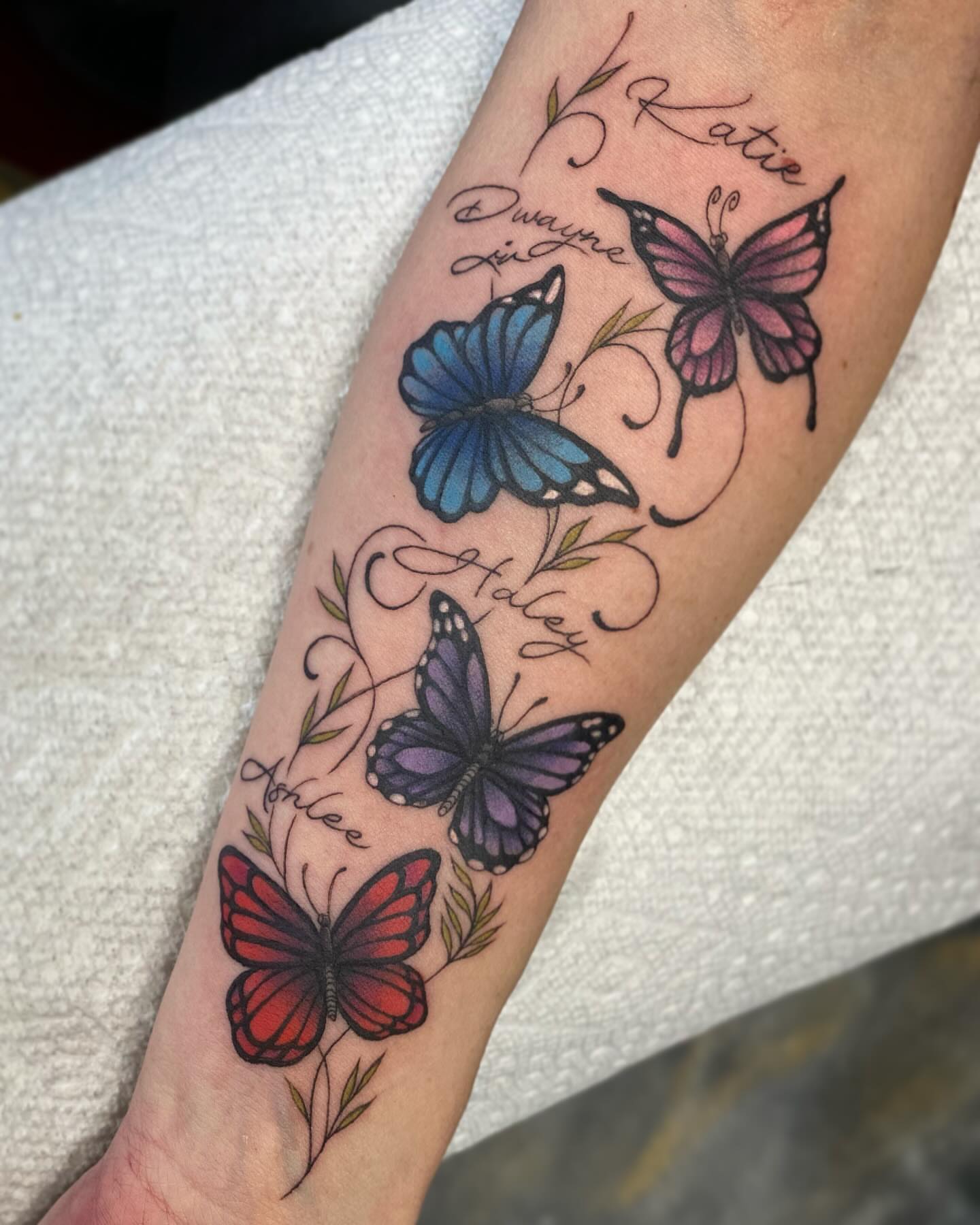 Butterflies new school tattoo on the forearm by Seth Mullin, Hemet, California