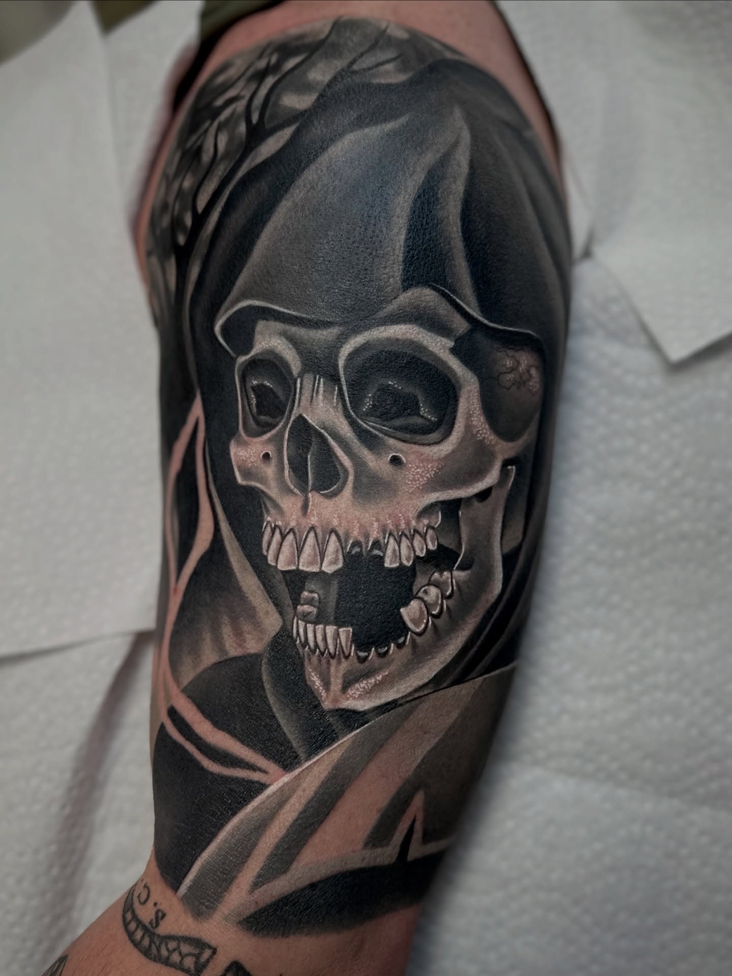Skull realism tattoo on the forearm by Savannah Compton