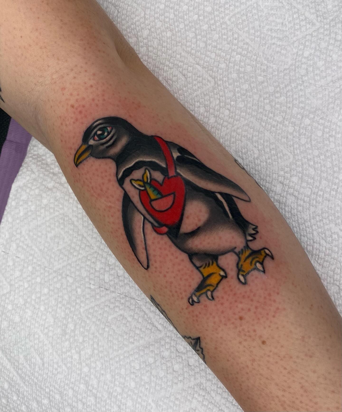Penguin American traditional tattoo on the forearm by Justin R. Mitchell, Fort Worth, Texas