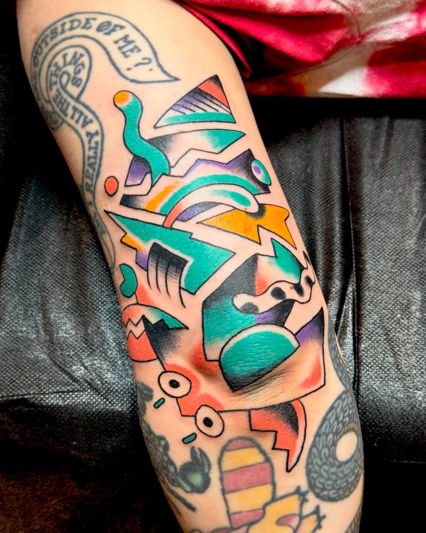 Abstract geometric shapes geometric tattoo on the forearm by Nick Rodin