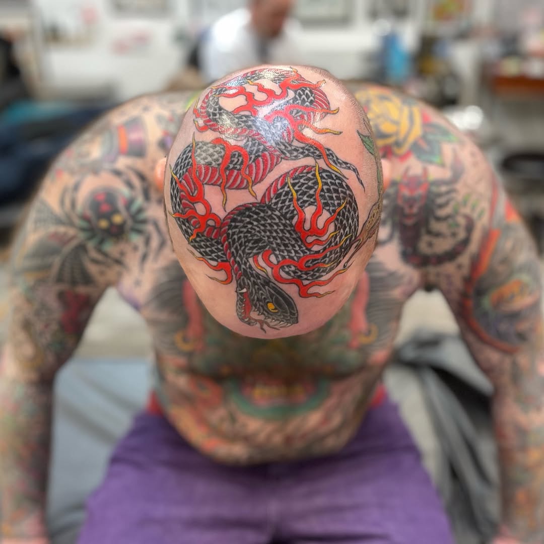 Snake and flames American traditional tattoo on the head by Mister Joe Joe Frisco Tattoo, San Francisco, California