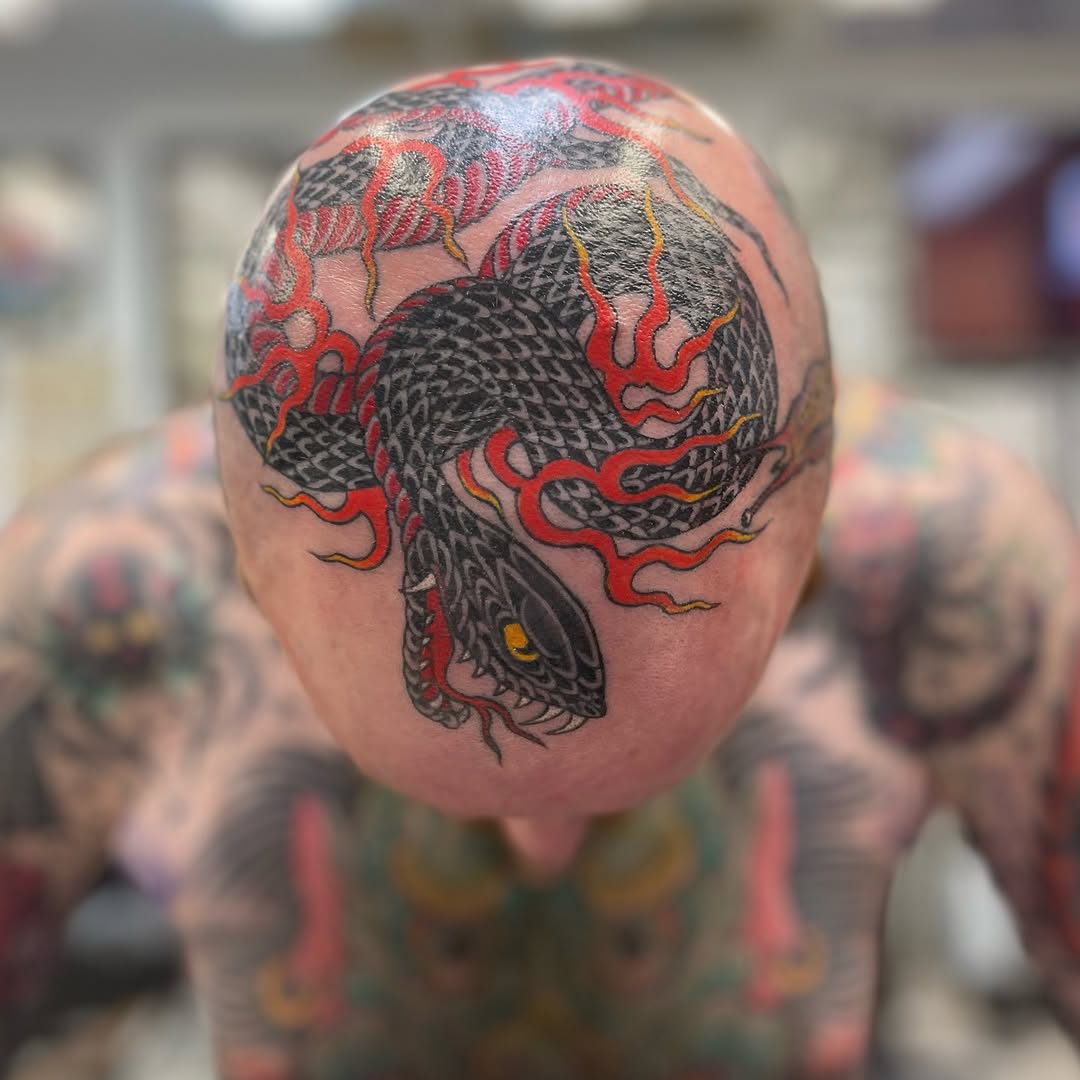 Snake with flames American traditional tattoo on the head by Mister Joe Joe Frisco Tattoo, San Francisco, California