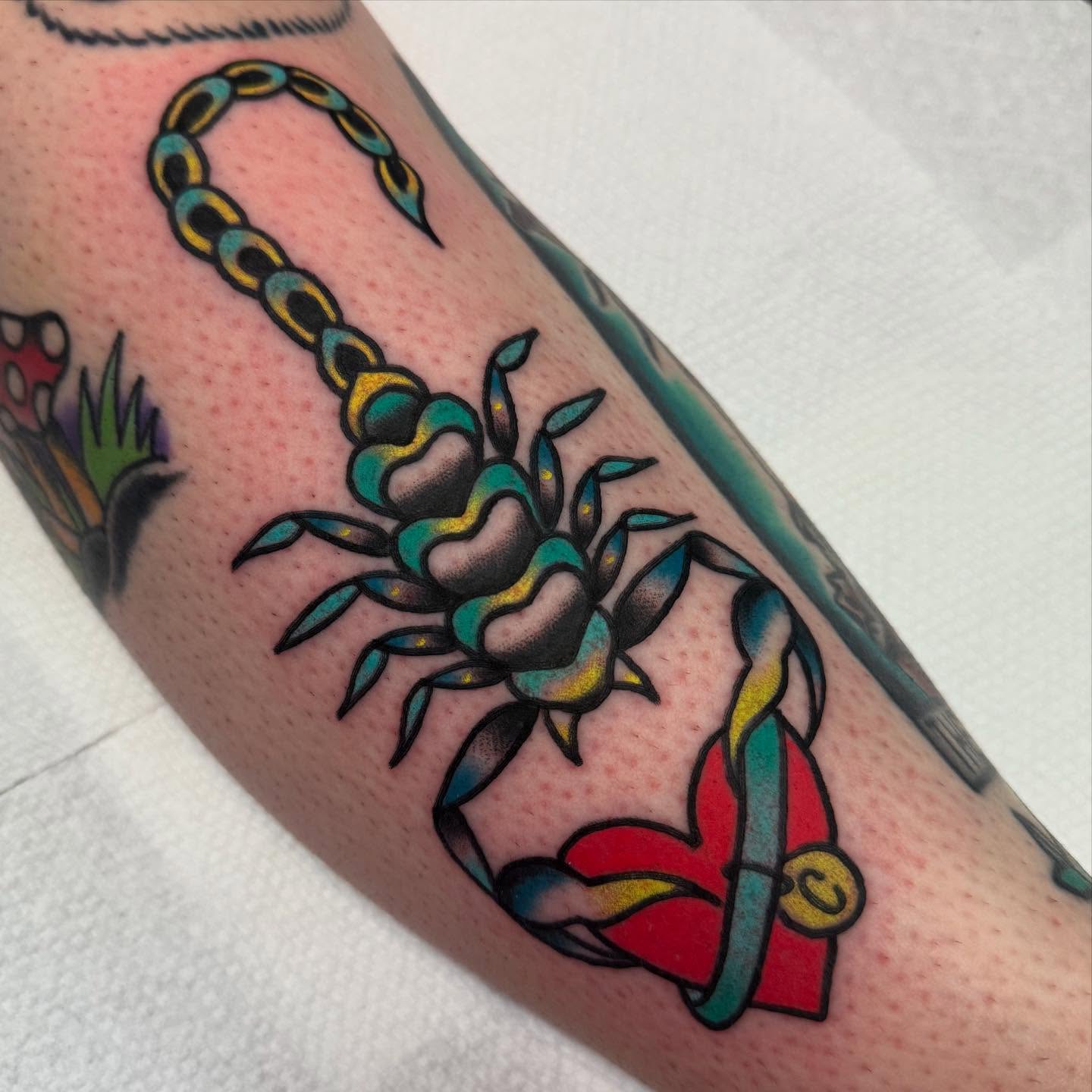 Scorpion and chain American traditional tattoo on the forearm by Shana