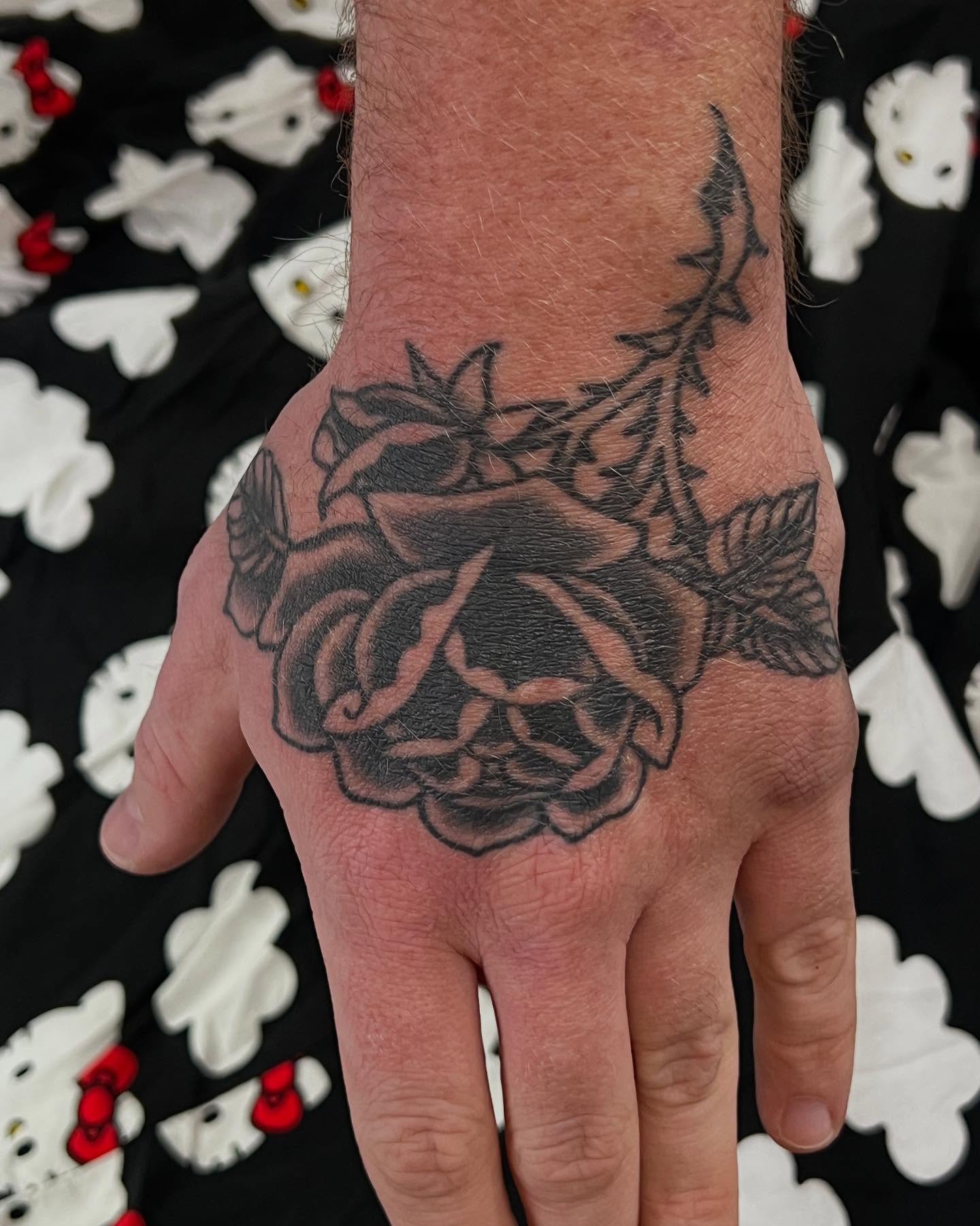 Rose black and grey tattoo on the hand by Levi Cox, Powell, Ohio
