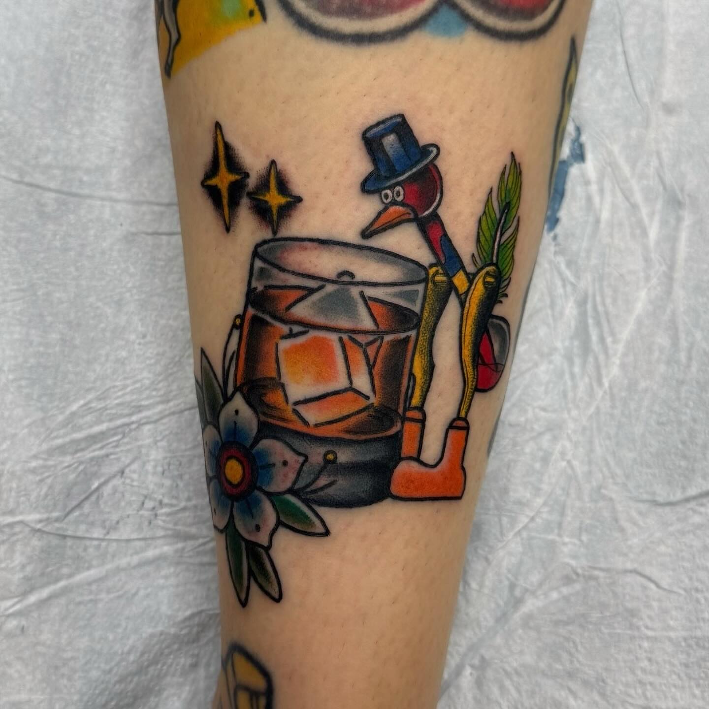 Drumming duck American traditional tattoo on the forearm by Jacie Aasen-Lupino