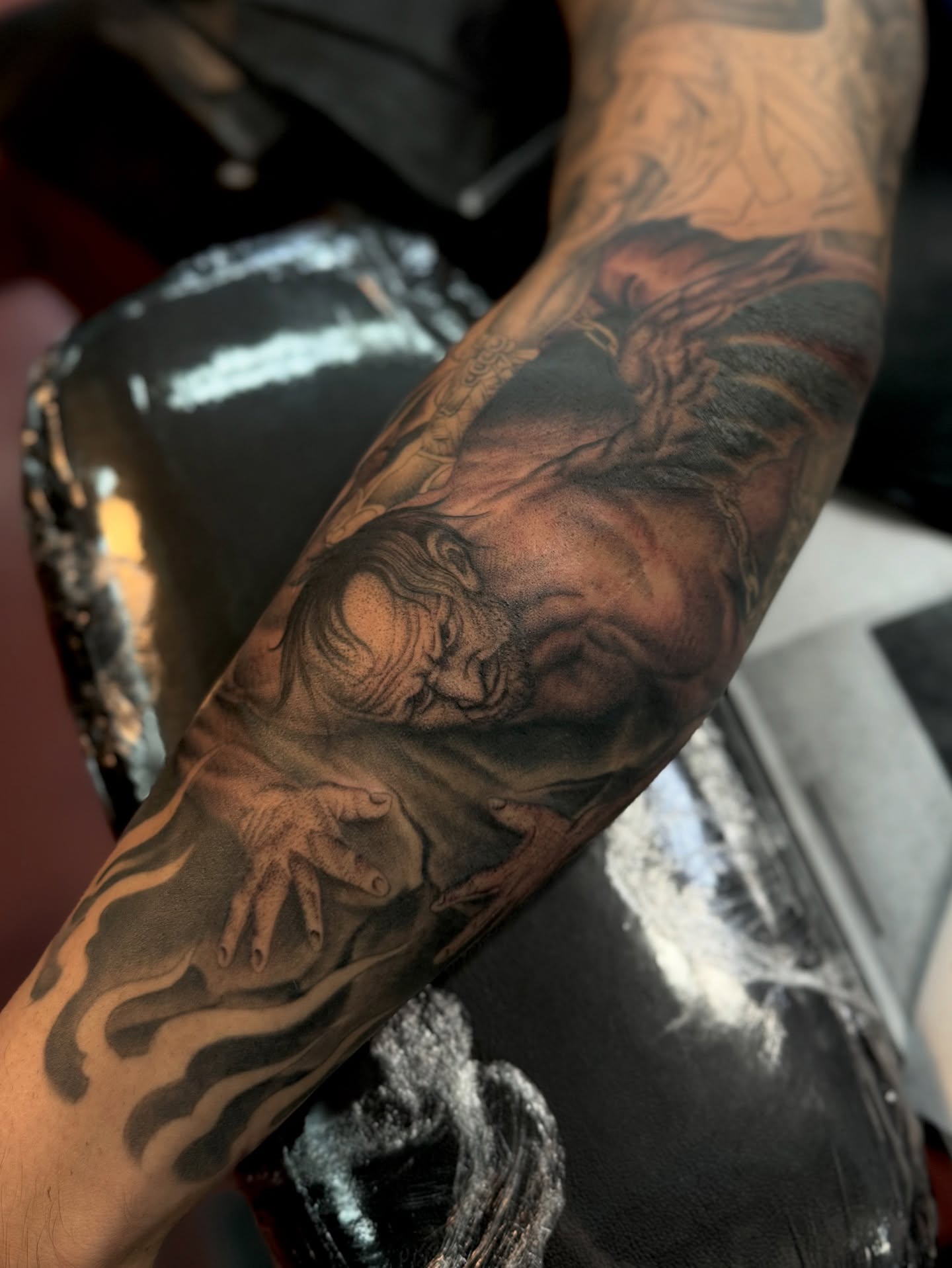 Religious figure realism tattoo on the forearm by Ernie Rivera