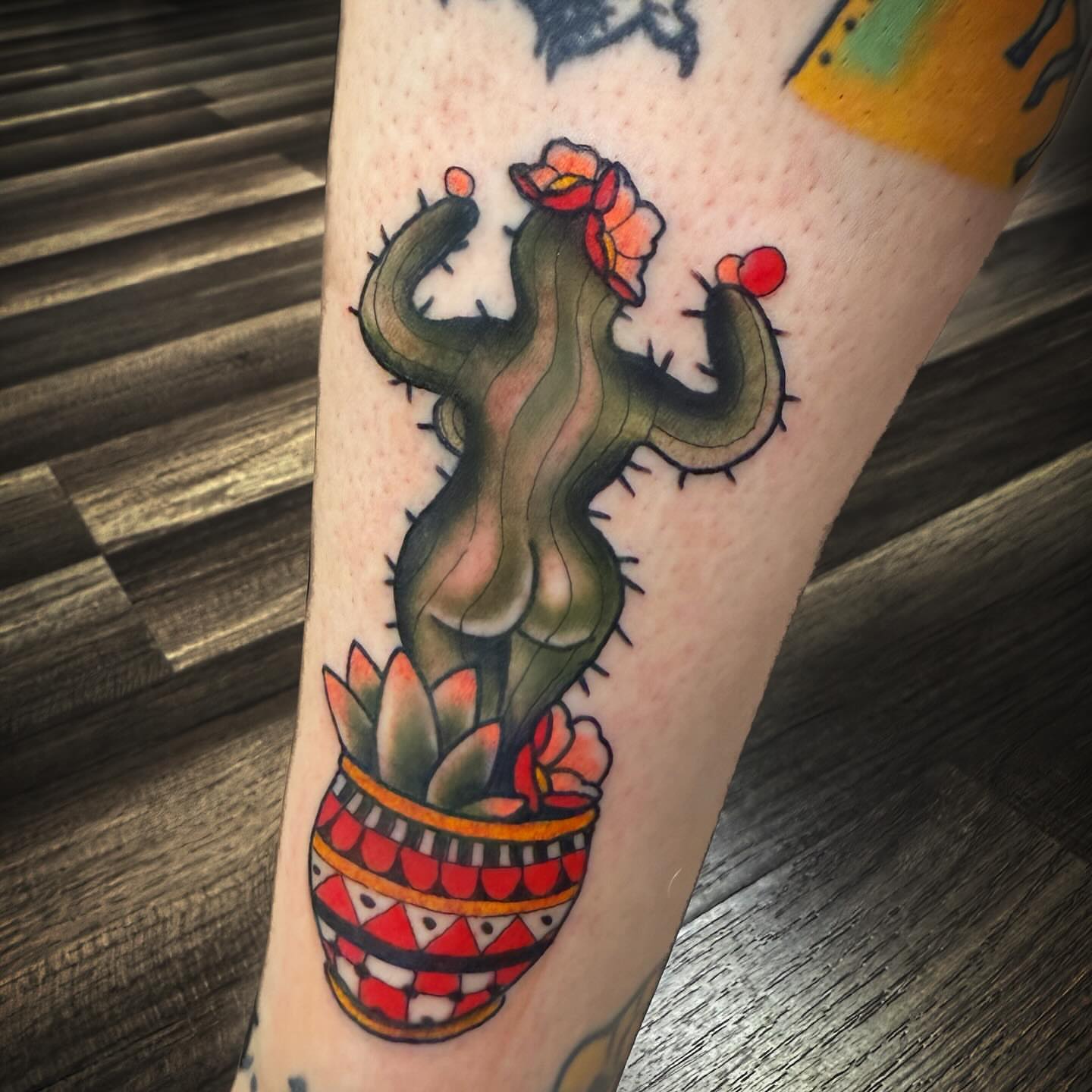 Cactus with flowers American traditional tattoo on the forearm by Jacie Aasen-Lupino
