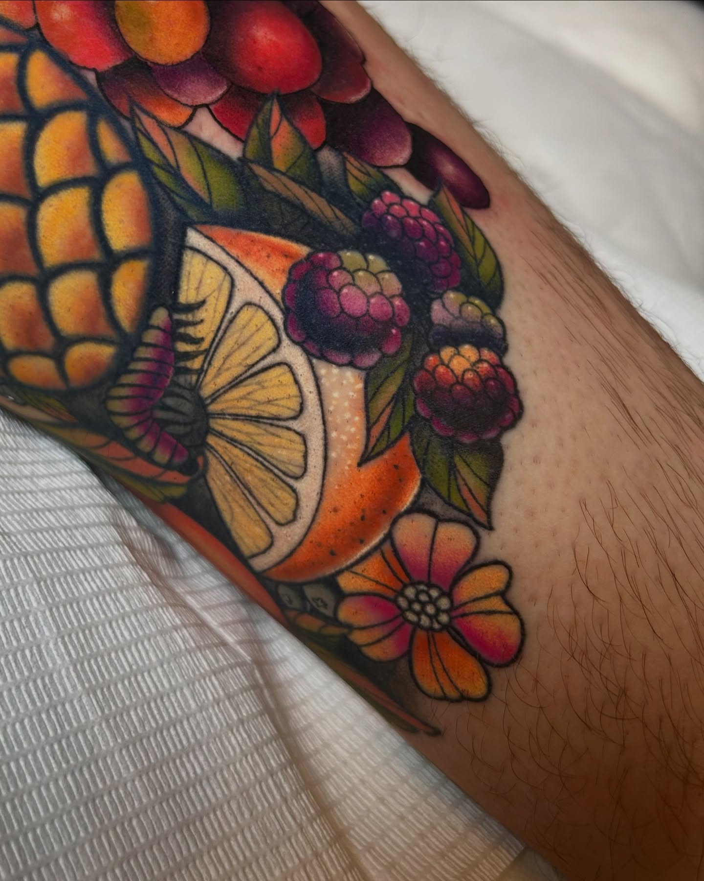 Fruit and floral bouquet American traditional tattoo on the forearm by Tattoos By Lola Cavotta, Willoughby, Ohio