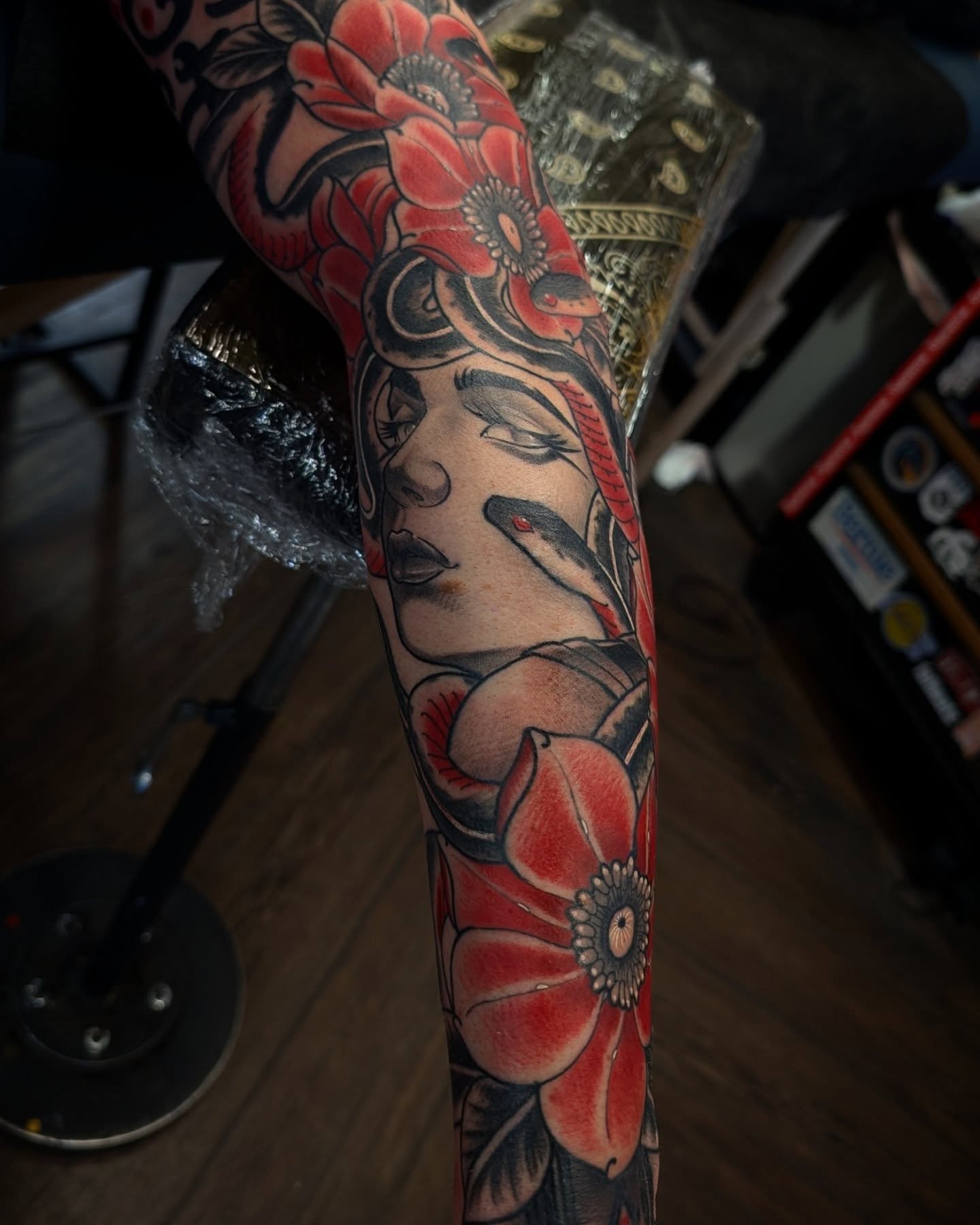 Woman with flowers American traditional tattoo on the forearm by 𝑹𝒆𝒚𝒎𝒂𝒓𝒄 𝑫𝒂𝒚𝒂𝒖𝒐𝒏