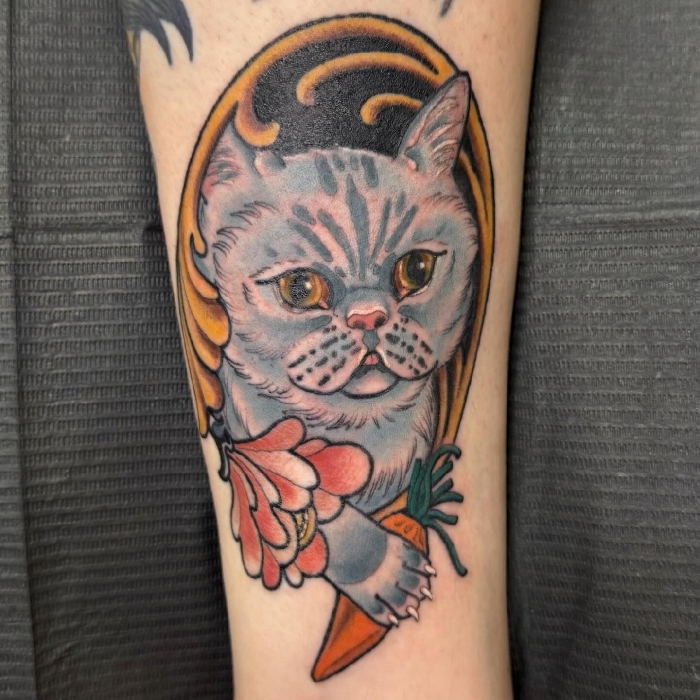 Cat American traditional tattoo on the forearm by Jacie Aasen-Lupino