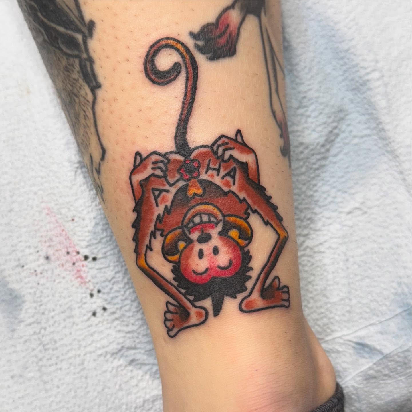 Monkey American traditional tattoo on the forearm by Jacie Aasen-Lupino