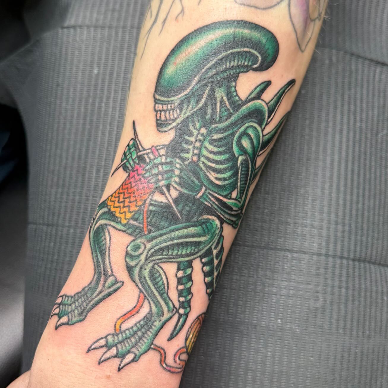 Alien creature American traditional tattoo on the forearm by Jacie Aasen-Lupino