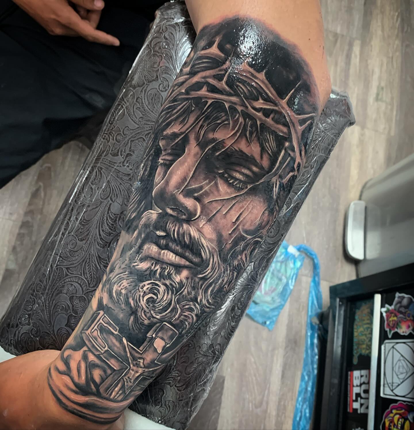 Religious figure realism tattoo on the forearm by Tonii Florrez