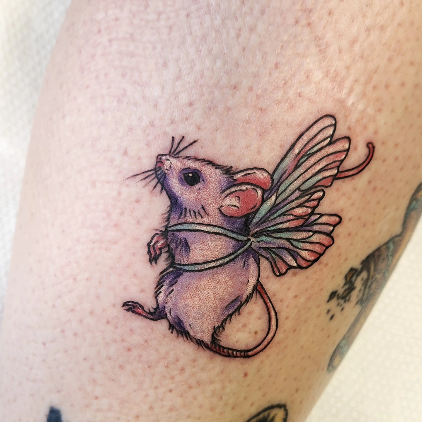 Flying mouse new school tattoo on the forearm by Heather