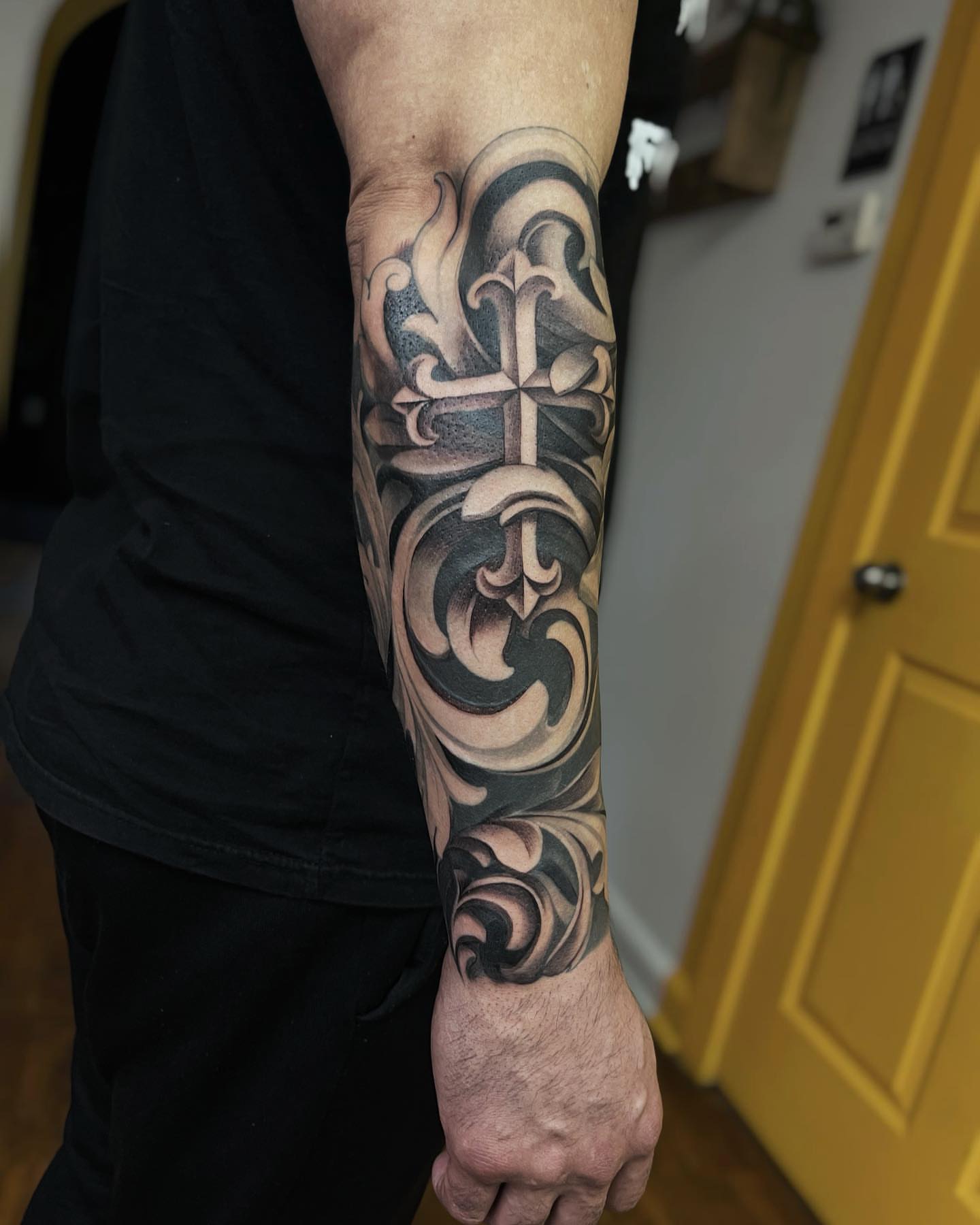Cross with ornamental flourishes ornamental tattoo on the forearm by π‘πΆπΈπ½ππ ππΎππππ