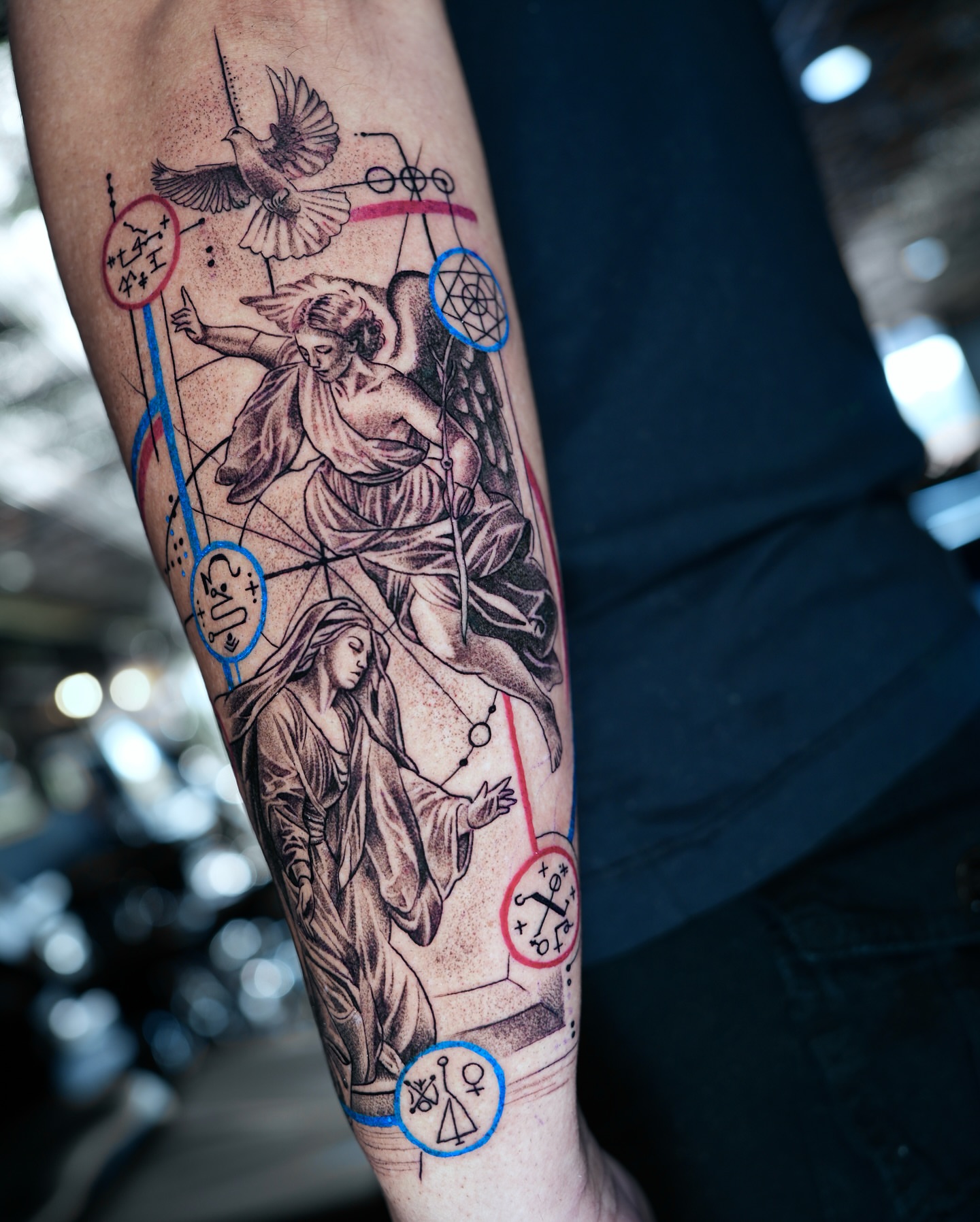 Religious figures realism tattoo on the forearm by Juan Carlos