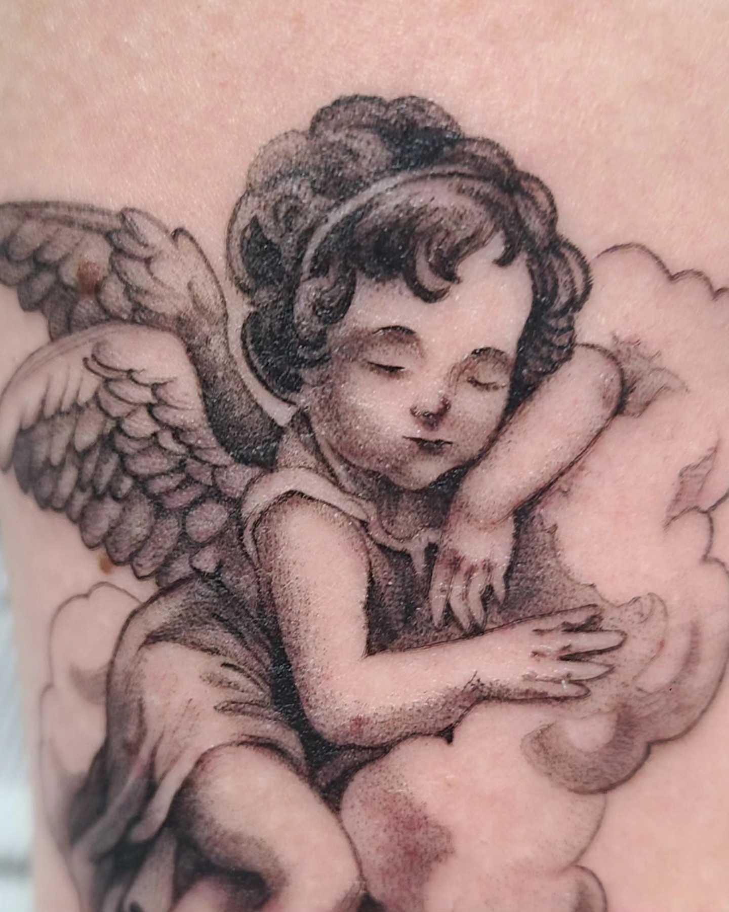 Cherub black and grey tattoo on the chest by David Vodicka