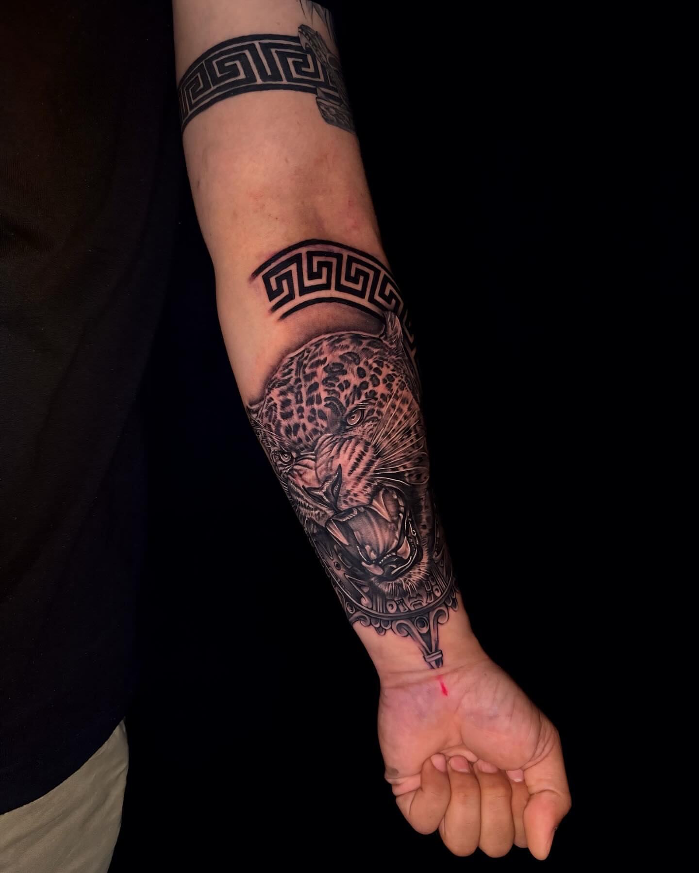 Leopard realism tattoo on the forearm by Tattoos By Chico