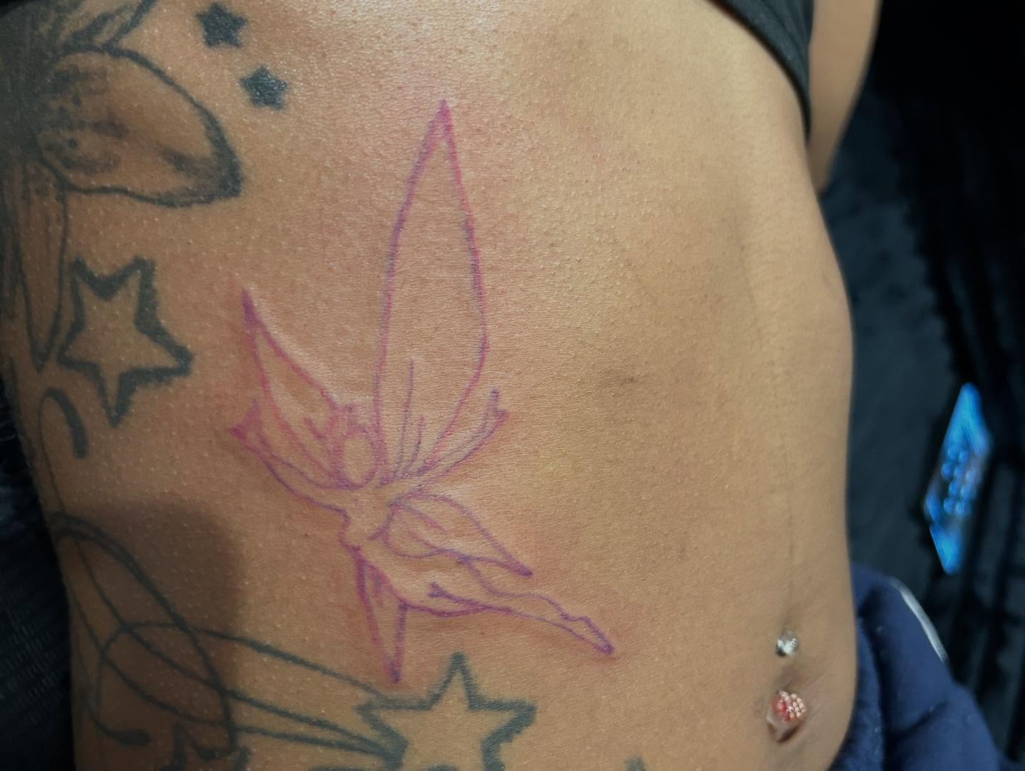 Fairy dotwork tattoo on the ribs by Airika Edwards