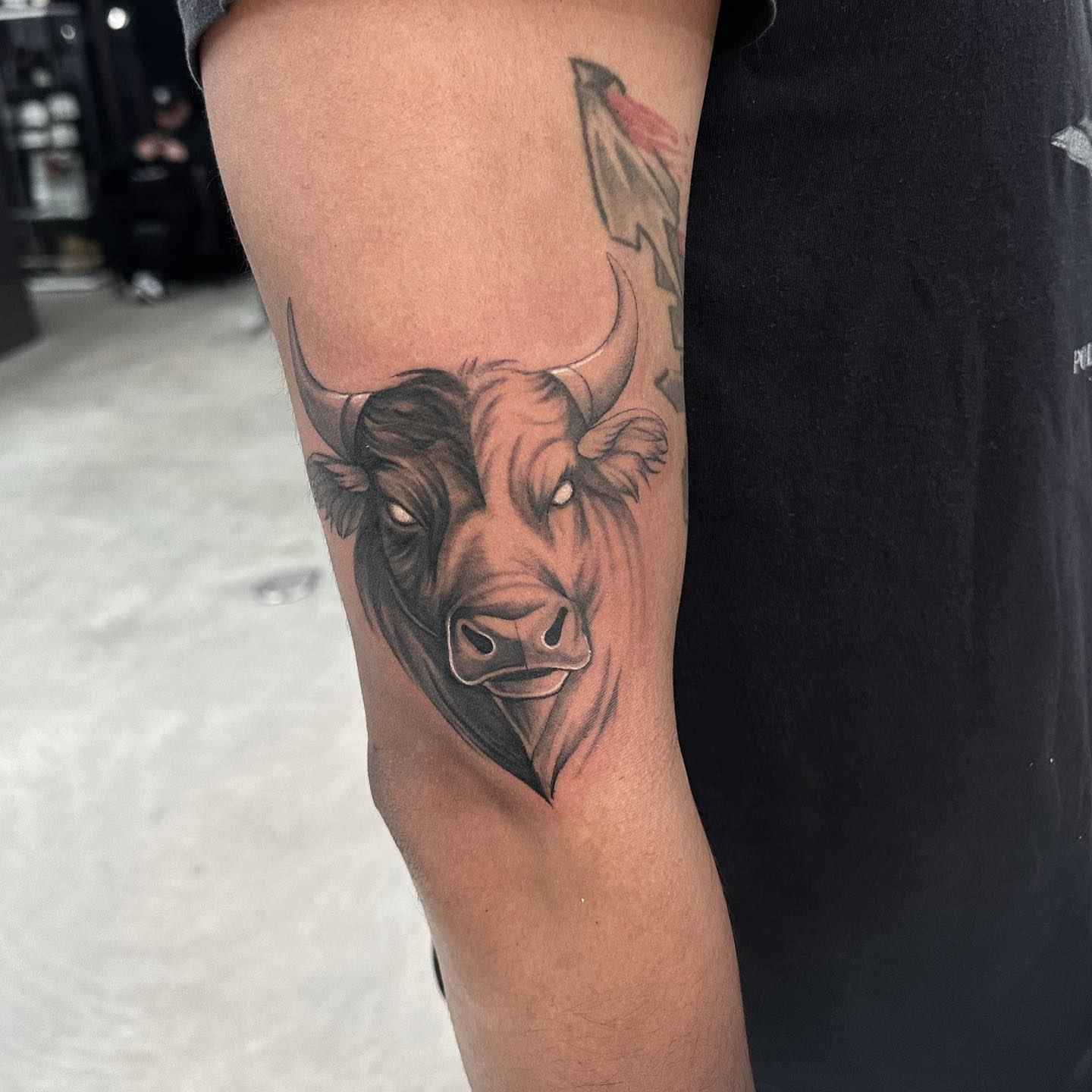 Bull head realism tattoo on the forearm by Angela Azure