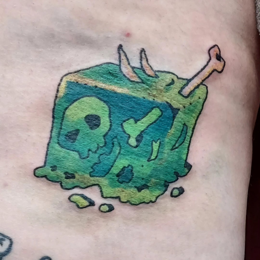 Squid new school tattoo on the forearm by Spike Cameron