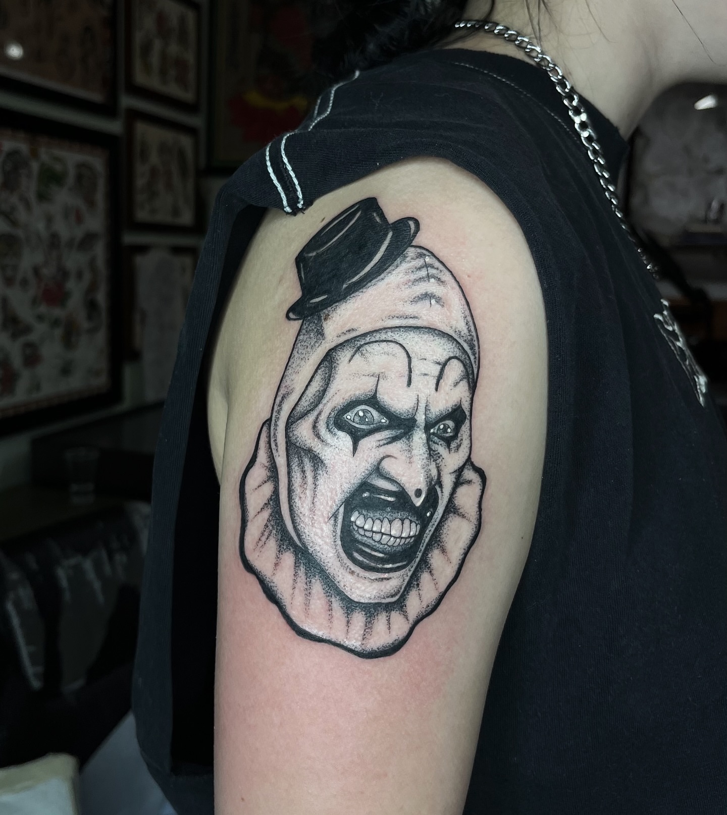 Clown dotwork tattoo on the shoulder by Taylor Newton