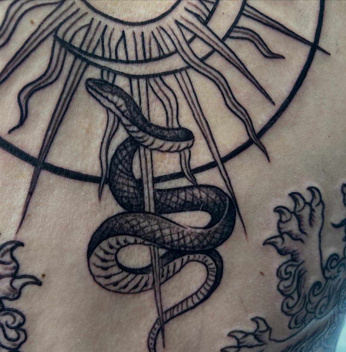 Snake black and grey tattoo on the chest by Josh Williams, Chattanooga, Tennessee