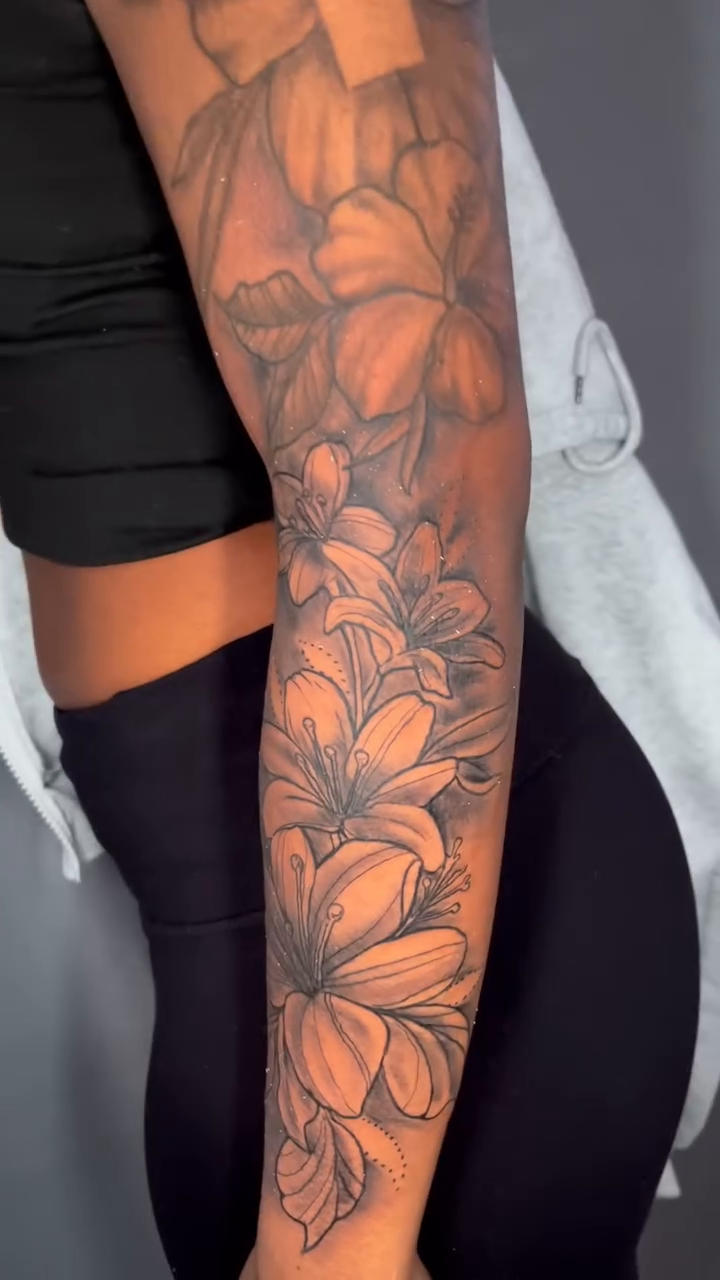 Flowers and a cross realism tattoo by Jakobi